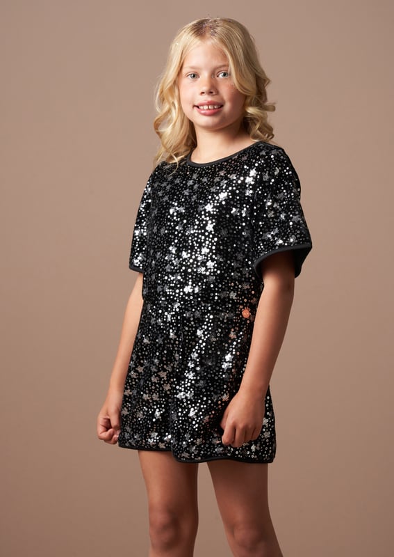 Little trendsetters - behold the party outfit of the season! Sequin stars adorn this cute playsuit and bring the party to your wardrobe. Wear with tights and chunky boots for maximum style credits.