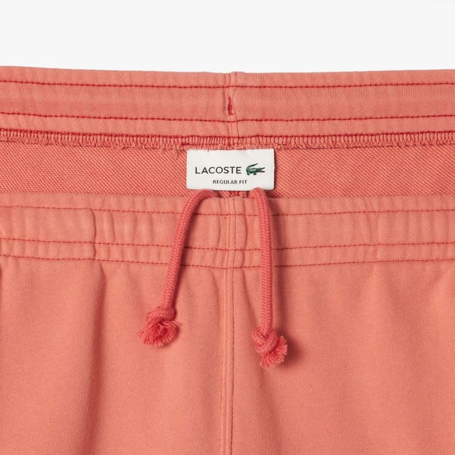 Washed Effect Lacoste Print Jogger Shorts Organic cotton fleece Regular fit  straight cut  Drawstring waist Contrast Lacoste print Embroidered crocodile on front Washed Effect Lacoste Print Jogger Shorts Organic cotton fleece Regular fit  straight cut  Drawstring waist Contrast Lacoste print Embroidered crocodile on front
