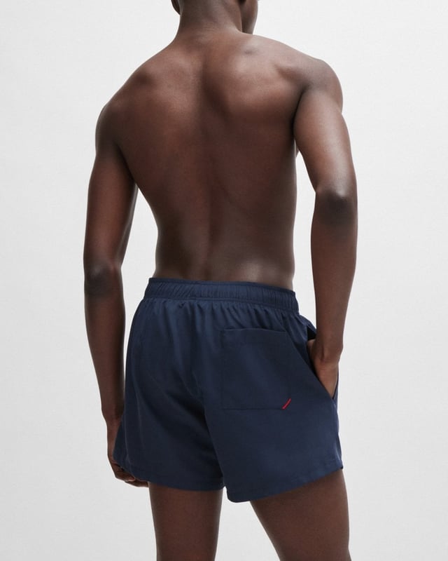 Modern swim shorts by HUGO. Designed in quick-drying fabric with full lining, this beach-ready pair features a vertical logo printed in contrast.
100% Polyester (recycled) , Lining: 100% Polyester
50513979