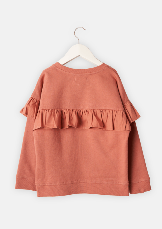 Putting an A&R twist on the humble sweatshirt. Pretty self colour woven frill on a soft canyon rose base. A wardrobe staple but by no means boring..  . About me: 60% Cotton 40% Polyester. Look after me: Think planet. wash at 30c.