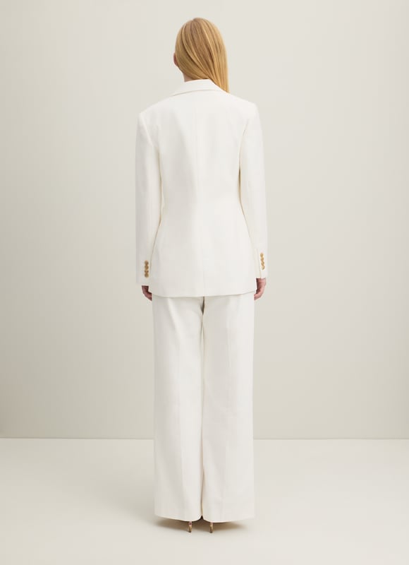 The perfect summer suit, the Avery jacket teams up with the matching waistcoat and trousers, but can also be worn to loosen up dresses or over jeans and a tee. Crafted in Portugal from beautiful Italian cotton in soft and textured cream, it has a straight cut, a wide, curved lapel, horn-effect buttons and large patch pockets to the front. Wear it with a pussy bow blouse and the Ami trousers or shrug it over a floral dress.