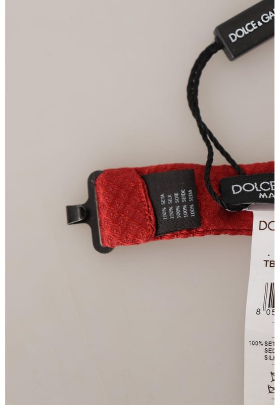 Absolutely stunning 100% Authentic brand new with tags
  From the exclusive Dolce & Gabbana collection
  Color: Red
  Model: Tied
  Material: 100% Silk
  Adjustable length neck strap one size
  Made In Italy
  Width: 4cm