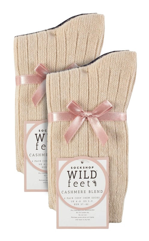 These ladies’ Wildfeet Cashmere Socks are the socks of luxury and comfort. Made from a blend of natural wool, viscose, and cashmere, they are designed to provide warmth and cosiness throughout the day, whether you're running errands or relaxing at home. These socks offer the perfect balance of luxury and practicality with a blend of wool, viscose, and cashmere. The soft and comfortable material provides warmth and insulation to keep your feet cosy in the cold weather while also being breathable and moisture-wicking. The combination of fibres makes these socks more durable, ensuring long-lasting wear, while the ribbed leg enhances comfort. The crew length and medium gauge thickness make them a good choice for any leisure shoes or boots, adding a touch of comfort to any outfit. These 4 pairs of Wildfeet Cashmere Socks come in 2 gift boxes and attractively wrapped with a satin ribbon bow, which makes them ideal for gifting to friends or family. Maybe even a last minute Christmas present or stocking fillers? Wild Feet is a range of socks featuring cool designs, bold colours and quirky catchphrases - from pugs and penguins, to lions and llamas! Choose from a range of styles for men and ladies, from dress to trainer socks. There are even some sporty styles available! There are 14 colours to choose from. They come in one size Ladies 4-8 UK, are made from 37% Wool, 27% Viscose, 24% Polyamide, 11% Cashmere, 1% Elastane and are machine washable.