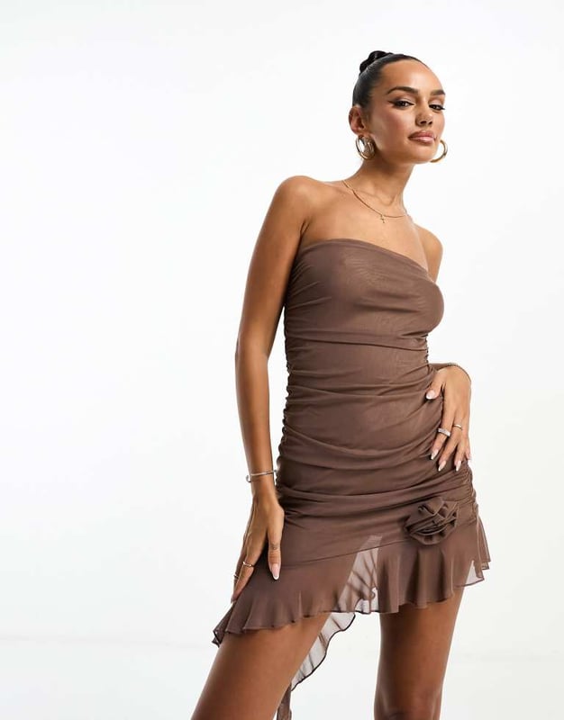 Missyempire mesh bandeau asymmetric ruffle hem mini dress in brown Dresses by Missyempire Coming soon to your IG feed Bandeau style Corsage detail Asymmetrical hem Regular fitSold By: Asos