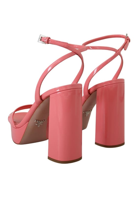 Brand: PRADA
  Condition: Brand new with tags
  Model: Block heels platform sandals
  Color: Pink
  Material: 100% patent leather
  Leather bottom sole for durability
  Logo details showcasing the iconic PRADA brand
  Made in Italy with high craftsmanship
  Exclusive and luxurious design
  Perfect for fashion-forward women
Material: 100% patent leather