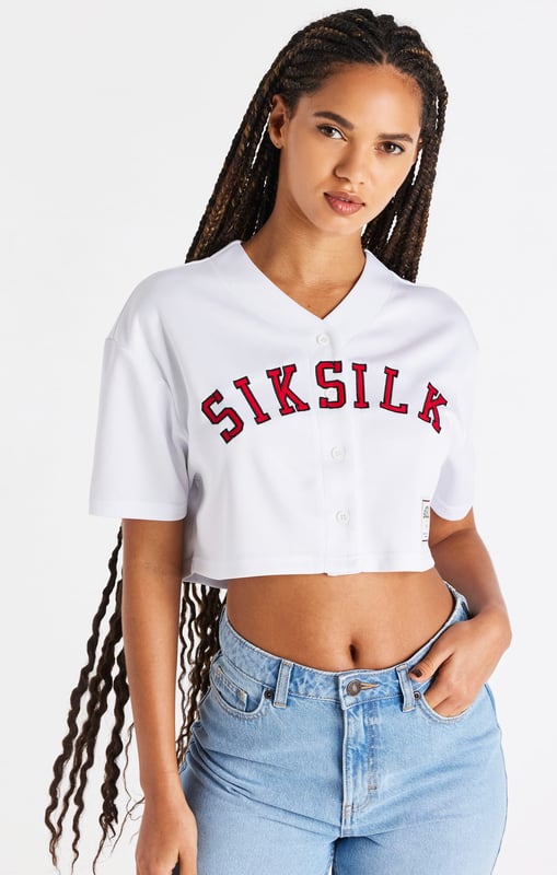 inchWhite Baseball Crop JerseyCrop fitSoft touch fabricApplique branded logoWoven badge brandingButton frontMachine wash100% PolyesterModel 5ft 7in and wears a size XS inch