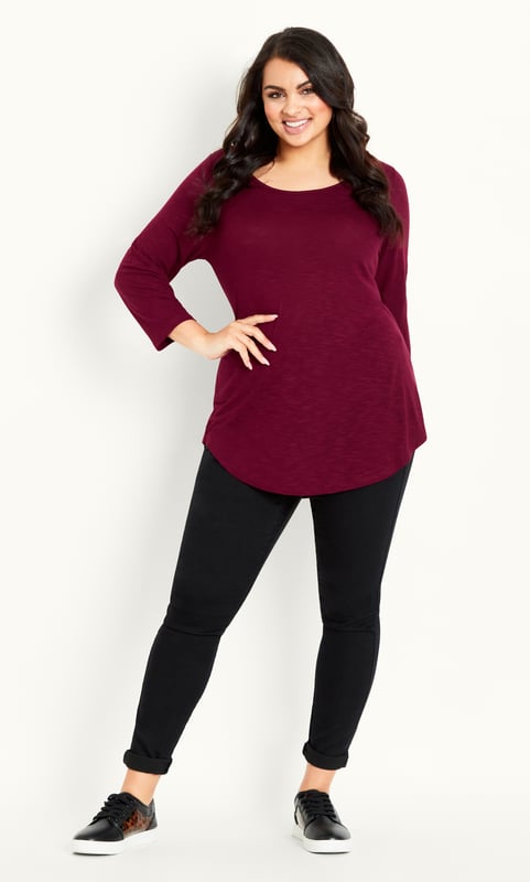 Opt for an elegant berry hue with our 3/4 Sleeve Slash Neck Top, offering a scoop neckline, 3/4 sleeves and soft stretch fabrication. Whether dressing down for a day at the shops or elevating your outfit for a dinner outing, this simple style can do it all! Key Features Include: - Scoop neckline - 3/4 sleeves - Relaxed fit - Soft stretch fabrication - Pull over style - Unlined - Hip length - Curved hemline Upstyle your evening look with leather look trousers, strappy stilettos and a chunky chain necklace.