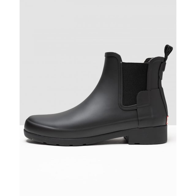With a slimmer fit ideal for city-living, the Women's Refined Chelsea features a tailored shape and moulded footbed for everyday wear. A rework of the classic ankle boot, each boot is ready for rain and handcrafted from natural rubber which has been vulcanised for superior protection. Retaining the iconic features of the traditional Chelsea, elasticated gussets and a nylon pull tab make for easy wear. Perfect for everything from city commuting to last minute lunches, this waterproof boot in classic black is a wet weather essential.
We recommend that all Hunter Chelsea boots be worn with Hunter Chelsea socks, which have been technically designed to protect the wearer's skin from contact with rubber in specific areas.
&nbsp;

&nbsp;

Waterproof
Handcrafted
Polyester lining
Elastic side gussets and nylon pull-tab
Rubber outsole with Hunter Original tread pattern
Moulded foot bed for enhanced comfort and support
Crafted from natural vulcanised rubber with matte finish

&nbsp;