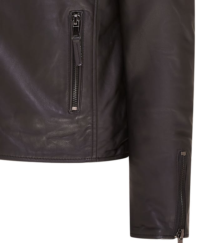 The centrepiece of a timeless look, this jacket is crafted with full grain nappa leather to achieve a slim fit stylish biker silhouette. Eye catching additions to this piece include ribbed detailing on the shoulders and a traditional wide collar. The front of the jacket is accented with a double zip and features a slanted zip pocket across the breast as well as a further two zip pockets. This jacket comes in a range of colours to suit a variety of tastes, allowing all to find their ideal style in this classic Brando style piece.

• 100% premium ultra-soft nappa leather.
• Slanted zip breast pocket • Double zip front, tagged for ease of use
• Wide notch stud fastened lapels
• Pockets integrated into the jacket lining
• Ribbed detailing on the shoulders
• Stylish zipped cuffs