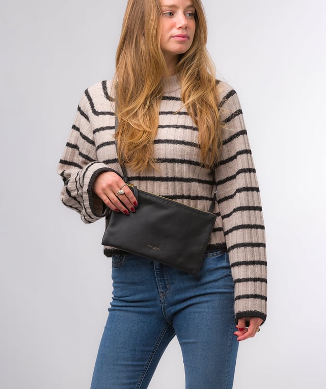 Crafted from high-quality Nappa leather, the 'Anya' cross body bag from Pure Luxuries London's Marylebone Collection is a must-have thanks to the super soft-to-the-touch feel and finish. A stylish zip-over top secures the central compartment which is lined with 100% cotton for a flawless look. Additional storage is provided by three card slots and a slip pocket, perfect for all your essentials. This accessory is adorned with a slim and adjustable strap with a maximum drop length of 65cm and complemented by eye-catching gold-coloured metal fittings and zips which give it an elegant look. The Pure Luxuries logo is embossed for an effortless and sophisticated finishing touch.