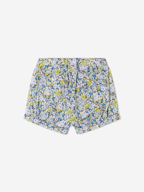 Introducing the Baby Girls Short Square Floral Shorts in Blue, a magnificently chic addition to your little girl's closet. Perfect for enhancing her charm in any setting. The key attributes that distinguish this piece are: Exquisite Design: adorned with a trendy and whimsical print, this unique piece instantly adds a pop of colour and style.  Premium Comfort: Made from superior quality materials, offering optimal comfort for your baby girl throughout the day.  Chic Appeal: Elevate your baby's fashion quotient with these lovely floral Bonpoint shorts. Grab them today and let your princess captivate every heart with her irresistible charm!