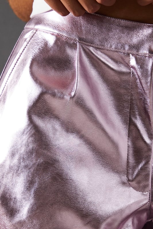 Eye-catching metallic finish for a bold statement
        Wide leg silhouette for a comfortable and trendy fit
        High-waisted design accentuates the waistline
        Front zip and button fastening for a secure fit
        Versatile style suitable for various occasions
    
    Make a dazzling entrance with these striking metallic wide leg jeans from Warehouse. Perfect for those who dare to stand out, these trousers combine comfort with high-impact style. The wide leg cut offers freedom of movement while creating a fashionable silhouette. For a night out on the town, pair these show-stopping trousers with a crisp white shirt, leaving it partially unbuttoned for a relaxed yet chic look. Add some platform sandals to elongate your legs and complete the ensemble with statement earrings. Whether you're hitting the dance floor or enjoying drinks with friends, these jeans will ensure you're the centre of attention. Their versatility also allows for more casual styling - try pairing with a simple black tee and trainers for an effortlessly cool daytime look that transitions seamlessly into evening wear.