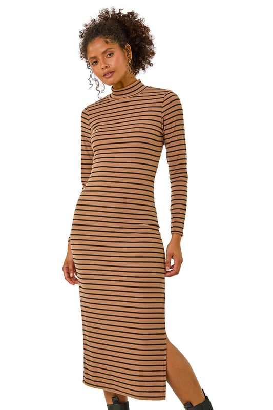 High Neck Stripe Bodycon Midi Dress from Roman. Elevate this Autumn Winter with our midi dress adorned in a timeless stripe print. Designed to finish at midi length, this dress showcases a flattering bodycon shape, complete with a high neckline and long sleeves to keep you warm throughout the colder season. Crafted from a cosy ribbed fabric, this dress is an essential to stay both stylish and comfortable. Pair it effortlessly with a denim jacket and boots for a complete fall look.