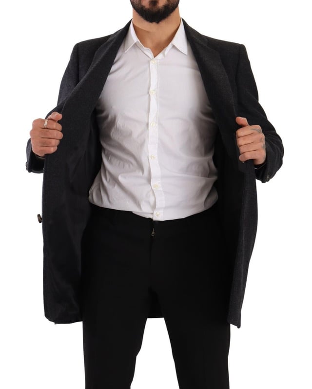 100% Authentic Dolce & Gabbana Single-breasted virgin wool coat
  Made from a blend of 80% Virgin Wool and 20% Nylon
  Dark grey color for a sophisticated look
  Three-button closure
  Logo details
  Made in Italy
  Lined with 50% Viscose and 50% Acetate fabric blend
  Quality craftsmanship