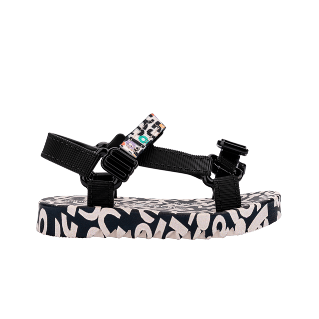 Experience unmatched fun and fashion with the Mini Melissa Playtime + Fabula - the sport sandal (papete) you never knew your mini desperately needed! The silhouette and has treaded soles and velcro straps with M logos. The insoles feature a unique, colorful print that is the perfect extra detail for a sunny day.