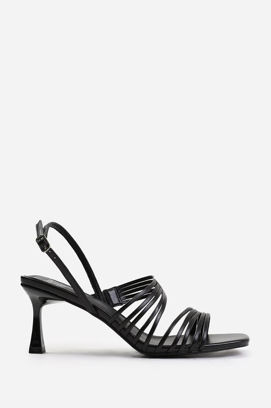 Wheres That From Womens 'Hailey' Square Toe Low Block Slingback Heel Introduce a touch of glamour to your footwear collection with our Hailey Square Toe Low Block Slingback Heel with Multi Strap Detail. These heels are the epitome of elegance and sophistication, making them the perfect finishing touch to any outfit, whether it's for a formal event, a night out, or a special occasion.Key Features:
Exquisite Design: The square toe silhouette of these low block slingback heels exudes a timeless appeal that never goes out of style. Enhanced by multi strap details, these shoes are guaranteed to make heads turn.
Multi Strap Details: The multi strap details doesn't just lend a chic and trendy vibe, but also offers secure and comfortable fastening. Adjust the slingback for a custom fit, ensuring these heels stay firmly in place.
High-Quality Construction: Crafted from premium materials, these high heels are designed to last. The high-quality construction ensures long-lasting durability while maintaining the comfort of your feet.
Specifications:
Material: Faux Leather
Heel Height: 3.3' (8.3cm) approx
Invest in our Hailey Square Toe Low Block Slingback Heel with Multi Strap Detail and bring that extra touch of elegance and sophistication to your wardrobe. They speak loud and clear of luxury and style – a piece worth showcasing!