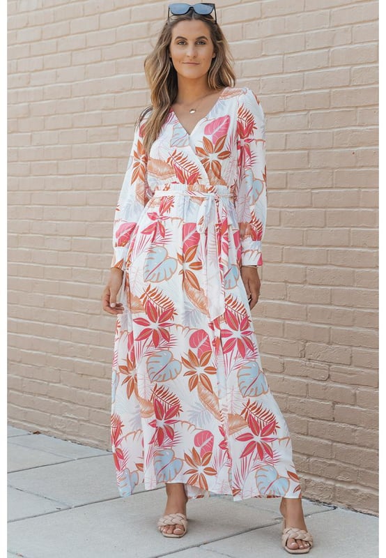 Tropical plant print adds a touch of nature
  Long sleeves provide coverage
  Wrap design and V-neckline create a flattering silhouette
  Slit detail adds a hint of allure
  Made from Quality materials
  Suitable for both casual and formal occasions