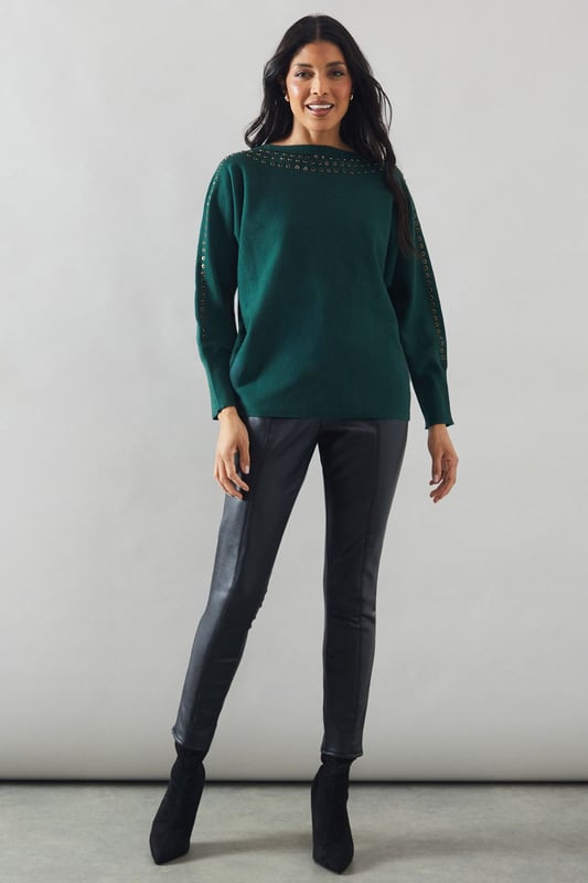 Boat neck design for a sophisticated silhouette
        Stud detailing along neckline and shoulders for added glamour
        Relaxed fit through the body for comfort
        Long sleeves for versatile styling
        Ribbed cuffs and hem for a polished finish
    
    This Wallis jumper seamlessly blends comfort with sophistication, making it a versatile addition to your wardrobe. The boat neck design creates an elegant neckline, while the stud detailing adds a touch of glamour to elevate your look. Perfect for casual events or family gatherings, this jumper can be styled effortlessly for various occasions. Pair it with sleek trousers and ankle boots for a chic daytime ensemble, or dress it up with a statement necklace and heels for evening drinks. The relaxed fit ensures all-day comfort without compromising on style, allowing you to feel at ease whether you're running errands or enjoying a leisurely brunch with friends. This jumper is a testament to Wallis' commitment to creating pieces that are both fashionable and functional, catering to the modern woman who values both style and comfort in her everyday attire.
