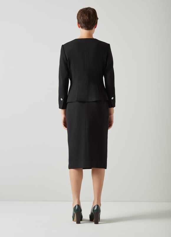 Beautifully tailored, totally timeless and kind to our planet, the new Sky jacket works as part of a wear-forever suit with the Sky skirt. Crafted in Europe from a black LENZING™ ECOVERO™ viscose* blend crepe, it's a shapely, single-button style with an open collar, a cut-away front and bracelet sleeves with button detail. Wear it with the matching pencil skirt when occasions call or for days in the office. This suit is a keeper. 

*More about the fabric
LENZING™ ECOVERO™ viscose uses up to 50% less emissions and 50% less water than standard viscose. This fibre relies on wood pulp, and is crafted from sustaibly maged tree species such as beech, spruce and eucalyptus.
