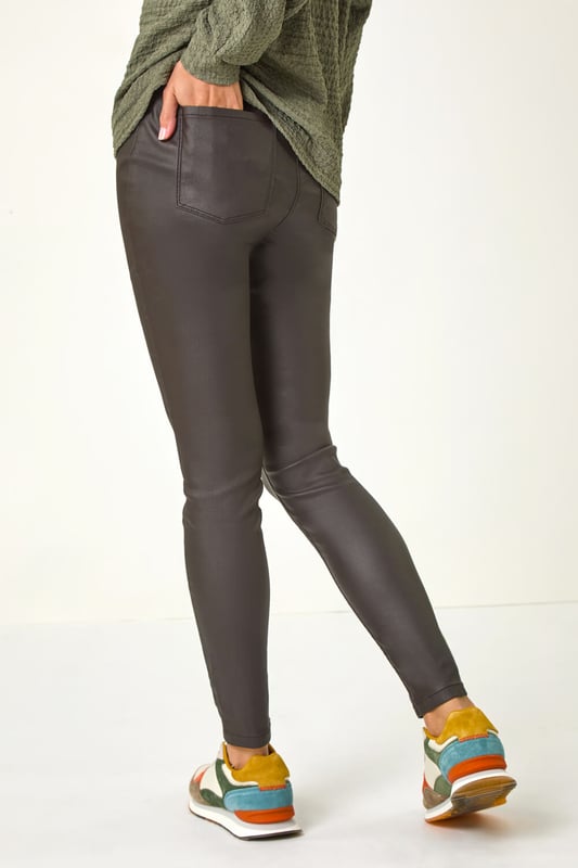Coated Faux Leather Jeggings from Roman. A twist on the classic faux leather leggings, this pair have all the intricate details you would find on denim. Functional back pockets and belt loops make these jeggings practical and easy to style. They have flattering stitch detail for extra interest. Cut in a skinny style from a stretch woven fabric these are designed to pull on for fuss free fashion!