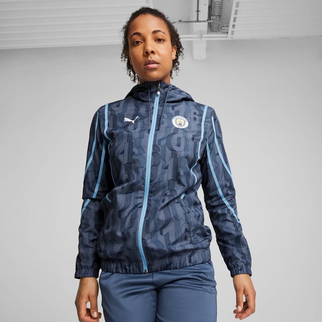 PUMA Womens Manchester City Pre-match Woven Jacket PRODUCT STORY: Train like the champions in this official Manchester City Pre-match Woven Jacket. With a regular-fit, full-zip closure, zipped pockets and our sweat-wicking dryCELL tech, it's tailored for optimal pre-match focus. It features Manchester City details, so you can represent the team with pride. FEATURES & BENEFITS: dryCELL: Performance technology designed to wick moisture from the body and keep you free of sweat during exercise; Made with at least 50% recycled materials. DETAILS: Regular fit; 80 gsm, Plain weave; Long sleeves; Full-zip closure; Zipped pockets; Official team branding. Our model is 174 cm tall and is wearing size S UK.