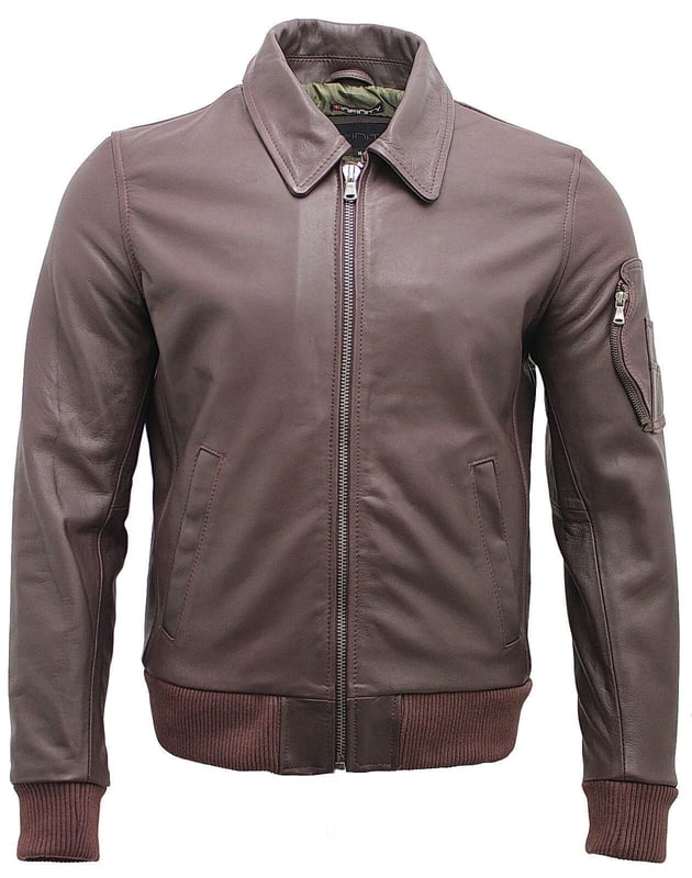 Invest in this timeless leather jacket, crafted from real cow hide leather. This bomber jacket features a classic shirt collar and is short in length and features 3 external zipped pockets for added practicality. To help provide a more customized fit the jacket features a ribbed hem and cuffs. Lend a sleek touch to your wardrobe with this simple yet smart and durable leather jacket