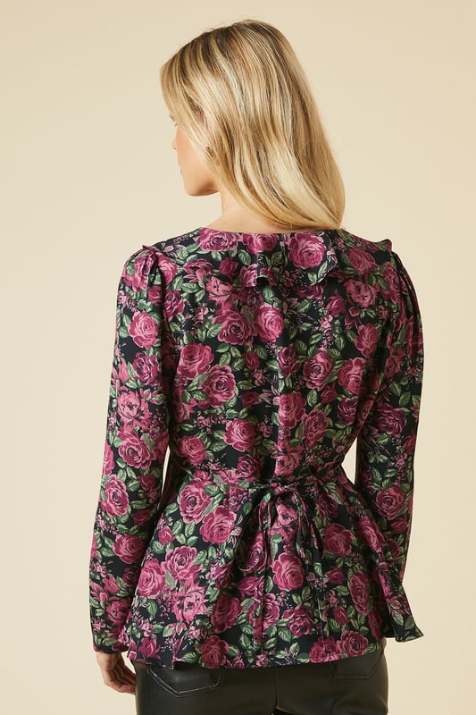 Charming floral print blouse with a romantic ruffle neck detail
        Flattering V-neckline with button-front closure for easy wear
        Long sleeves with subtle gathering at the shoulders for a feminine touch
        Elegant tie-back detail to accentuate the waistline
        Versatile tea blouse style suitable for various casual occasions
    
    Embrace effortless elegance with this Dorothy Perkins petite floral blouse. Perfect for the fashion-conscious woman in her 30s, this piece strikes the ideal balance between trendy and modest. The ruffle neck and button-front design add a touch of vintage charm, while the long sleeves provide comfort and coverage. Style this versatile top with slim-fit trousers and ballet flats for a chic brunch look, or pair it with dark denim and ankle boots for a casual family gathering. The tie-back detail allows for a customised fit, ensuring you look polished whether you're attending a baby shower or meeting friends for coffee. This blouse is a wardrobe essential that seamlessly transitions from day to evening, making it the perfect choice for the modern woman who values both style and practicality.