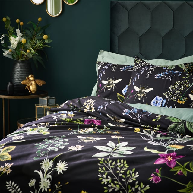 A striking digitally printed duvet set featuring an eye-catching contrast design, which will brighten up your bedroom in an instant, Busy bees hover among the bright, fresh florals of a meadow or garden, which are set on a contrasting luxuriously soft velvet jet black background. This exquisite set adds lovely pops of colour to your bedroom and gives it a natural feel too, helping you wake up in the morning and feel refreshed.