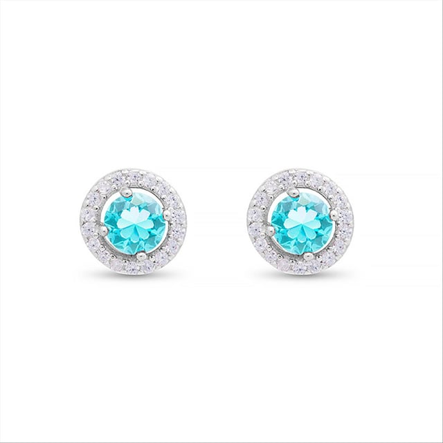 Legend oorbellen in 925 sterling zilver met aquamarijn zirkonia edelstenen en gerhodineerde afwerking. De naam van de serie ondersteunt dit: ATELIER Colour. Sieraden die zich overgeven aan een atypisch ontwerp dat deze sensuele ontwerpen in een bevoorrechte positie heeft geplaatst: onderdeel van de garderobe van de moderne vrouw. Het ontwerp bestaat uit gekleurde zirkonia's die zorgvuldig met de hand zijn gemaakt op een 925 sterling zilveren basis.  Een herdefinitie van juweelontwerp dat zich materialiseert in strakke en eenvoudige ontwerpen. Creaties die vrouwelijke uniciteit uitdrukken: ready-to-wear.