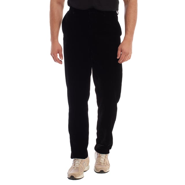 Velvet trousers by Emporio Armani, designed for those looking for a garment of high sophistication and impeccable style.

 Crafted from high-quality black velvet, it offers a soft and luxurious texture, ideal for standing out on formal or semi-formal occasions.

 It features a hidden hook and button closure instead of a zipper, also hidden, providing an elegant and minimalist finish.

 Slanted side pockets add a functional touch, while back welt pockets with button closures complete the design with a classic feel.

 These Emporio Armani pants are the perfect choice for those who want a combination of comfort, exclusivity and timeless style.
 Composition: Fabric: 76% Viscose, 26% Elastane; Lining: 65% Acetate, 35% Viscose
 Care:
- Machine wash on delicate cycle.
 - Use similar colors in the wash.
 - Avoid the use of bleaches.
 - Do not dry.
 - Iron at low temperature.
 - Do not dry clean.