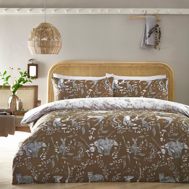 Explore our cosy and delicate take on the beauty of woodland creatures as you rest in the Buckthorn duvet cover set. Hand-drawn rabbits, foxes and bears pose among the delicate florals, which are set on an earth toned background. Flip the set over and the same design appears, but this time in inverted colours, giving you a fresh, evergreen look. An adorable and down to earth addition to your bedroom.