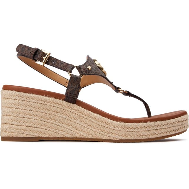 Michael Kors Casey Keilabsätze Sandalen Genießen Sie die Feiertage mit der Michael Kors Casey Espadrille Wedge Sandale, die ein Zehensteg-Design aus weichem Leder und eine mit Jute umwickelte Sohle und Ferse für einen Boho-Touch präsentiert. Die Gummisohle bietet bei jedem Schritt Halt, und das goldene MK-Branding fügt einen Hauch goldener Opulenz und Designer-Stil zu jedem Schritt hinzu. Perfekt zu Maxikleidern oder verkürzten Jeans für einen urlaubsbereiten Look.