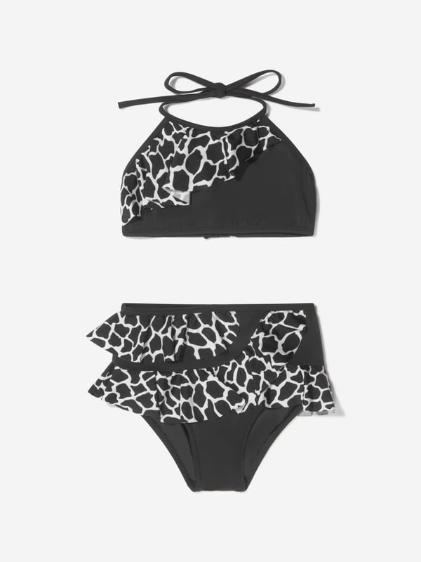 Unveiling the Girls Tinto Bikini (UV50 Sun Protection) by Nessi Byrd, an ultimate showstopper for your little girl's summer wardrobe. Key features: Elegant Design: Crafted to perfection with a designer finish, mixing style with sun protection for your little diva.  UV50 Sun Protection: Maximum protection against harmful sun rays, offering carefree fun under the sun. Luxurious Comfort: Made from unique, high-end fabric for unrivalled comfort and durability, withstanding countless beach adventures.  Unrivalled Quality: A product of Nessi Byrd's renowned quality, prepare to dazzle at the beach with this designer piece. Order now, upgrade your little girl's summer style!