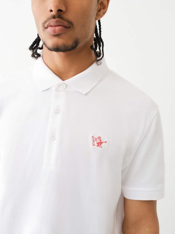 Pop that collar with the Buddha Patched Logo Polo Shirt. Crafted from soft cotton, this men’s polo features a basic collar. half-button placket, and short sleeves. Finished with a relaxed fit, ribbed trim, and a chest Buddha patch.