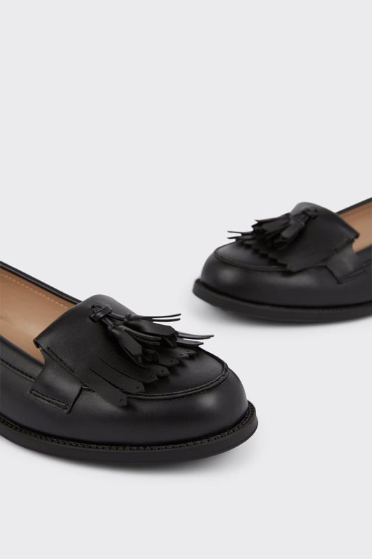 Whether you're dressing up for a formal occasion or looking to elevate your everyday style, this loafer is the perfect choice. Step out in confidence and make a statement with our timeless fringed tassel loafer.