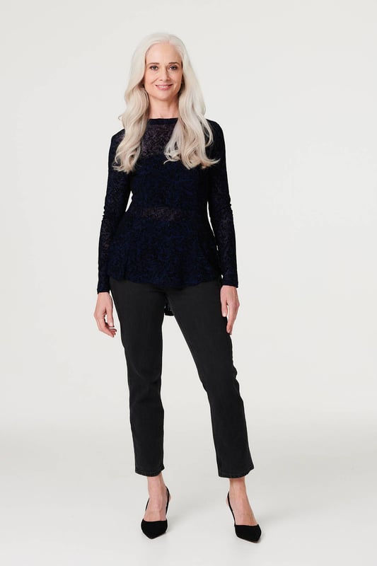 Stand out from the crowd in this delicate lace print peplum mesh top. With a high round neck, long sleeves, a high low hem and a sheer mesh fabric. Style with a cami top, high waist trousers and heels for an elegant evening look or be daring by layering over a bralette and high rise faux leather trousers and heels for cocktail hour.