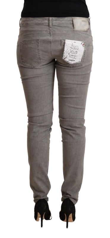 Brand: ACHT
  Material: 98% Cotton 2% Elastane
  Color: Gray washed
  Fit: Slim
  Waist: Low
  Closure: Zipper and button
  Style: Skinny Denim
  Details: Logo details
Material: 98% Cotton 2% Elastane