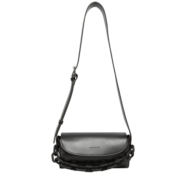 This Lyra barrel crossbody bag is made with durable PU unlined faux leather. With an adjustable crossbody strap and a magnetic close fastening. It is finished off with a stylish chain detail across the front of the bag.