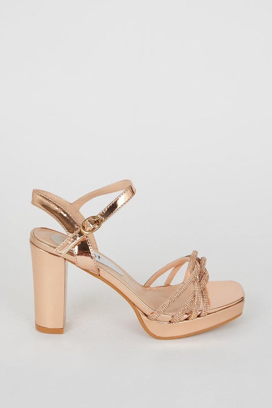 Taking you to new heights, heels can give you the confidence to feel like a brand new person. With lots of bold styles to choose from such as dazzling glitter slingbacks, feather embellished pumps, satin stilettos and cross-over platforms, our heel collection will have you planning your outfits from the feet up. Style: Taylor Diamante Platform Heeled Sandals.  Ideal for: Occasion.  Fit: Regular.