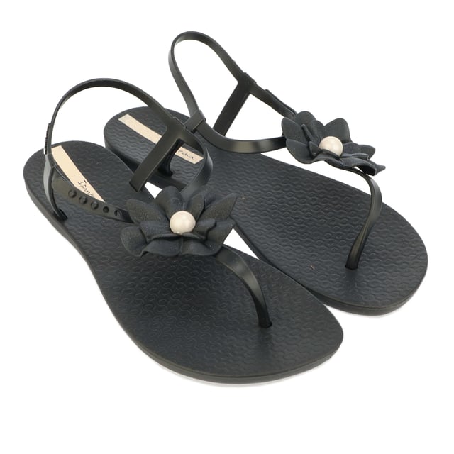 Womens Ipanema Flora Sandals in black.- Rubber upper.- Adjustable ankle strap.- Displaying a flower with a Pearl at the centre.- Lightly glittered petals.- Almond-shaped toe.- Slightly chunkier heel.- Rubber sole.- Ref: 26845AF381