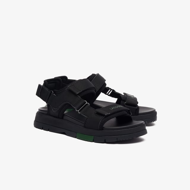 • Padded neoprene cushioning under straps • Synthetic leather footbed • Rubberised print Lacoste wording to front strap • Crocodile heel branding to rear strap • Lightweight rubber outsole with colour-blocked sections.