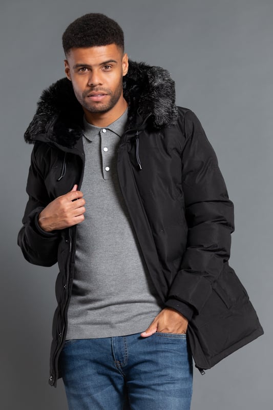 This longline hooded padded jacket from Nines by Kensington Eastside will ensure you are kept warm on colder days. Features faux fur hood with toggles and inside fur lining, zip and popper fastening, two large zip fastening pockets with divider, and ribbed elasticated cuffs for extra comfort.