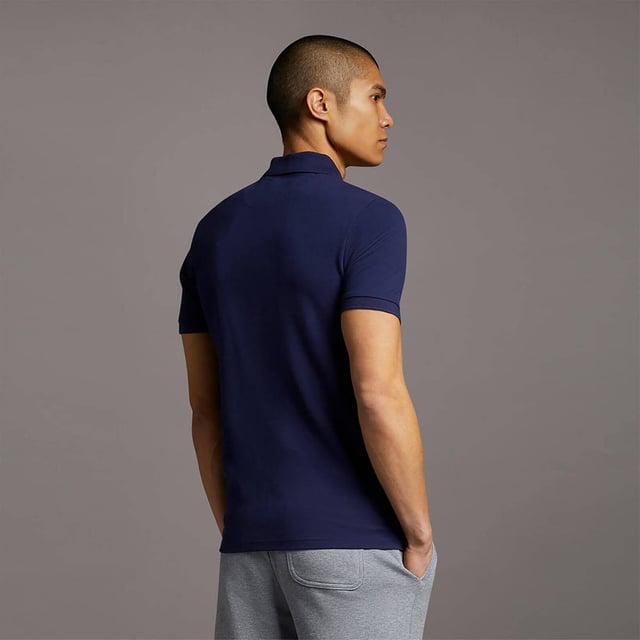 The ultimate Lyle & Scott style icon, our Plain Polo Shirt has a been at the forefront of fashion for decades. Available in an array of colours and constructed from a lightweight, soft cotton-blend, our polos are a wardrobe essential. Imbued with elastane so added stretch and finished with classic ribbed collar and cuffs, three-button placket with detail stitching, plus our signature Golden Eagle, a mark of true British heritage. 
 
Fit: Regular
It is crafted to fit the body neither too tightly or too loosely, leaving you with a classic, timelessly stylish look. We recommend you order your usual size, but if you're caught between two, go a size up.