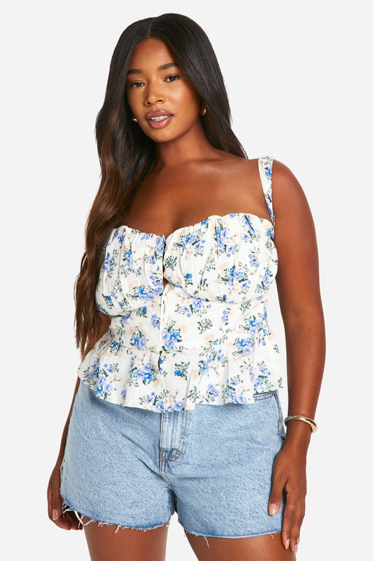 Introducing your new fave top from our latest collection of plus size tops. Chic, versatile, and the perfect addition to your new-season wardrobe, this style is everything you've been scrolling for. Pair with your fave jeans and chunky trainers for off-duty days or go all-out with wide leg trousers and statement heels. Want more? From wardrobe essentials like plus size shirts, to stand-out styles from our plus size party tops edit, find your everyday 'fits right here. Style: CorsetDesign: FloralFabric: Cotton PoplinLength: RegularSleeve Length: Strappy
