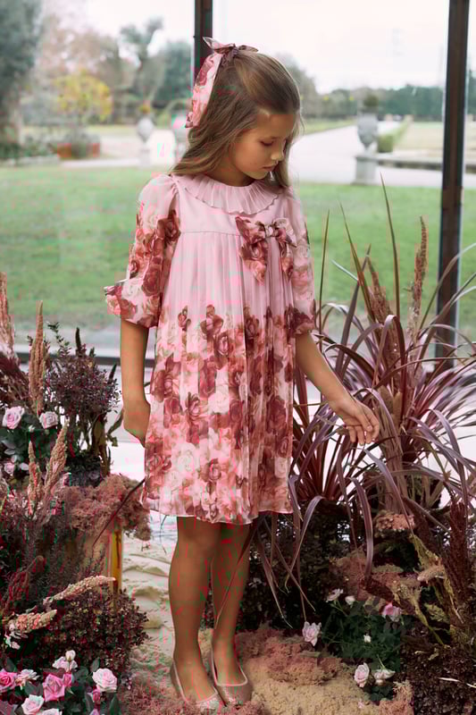 Introducing the luxurious Girls Floral Chiffon Dress in Pink by patachou, an enchanting choice for AW2024. This dress combines exquisite design and comfort, perfect for stylish young ladies. ‚ Elegance in Design: Beautiful pink chiffon adorned with delicate floral patterns encapsulate sophistication.‚ Premium Quality: Crafted from high-end materials, ensuring durability without compromising comfort.‚ Versatile Style: Ideal for occasions or casual chic days ‚ì a timeless addition to her wardrobe.Elevate her fashion with patachou's stunning piece. Order now and make her the belle of any gathering!