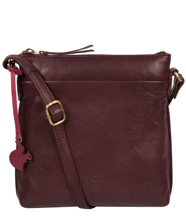 The 'Nikita' cross body bag from Conkca London is handcrafted from natural leather for a classic yet contemporary finish - perfect for elevating any look. With two full-length slip pockets on the exterior of the bag which arte perfect for on-the-go storage, complemented by a 100% cotton lining for a flawless finish. Comes with an adjustable leather strap and is adorned with the unimitable Conkca London squirrel logo and charm.