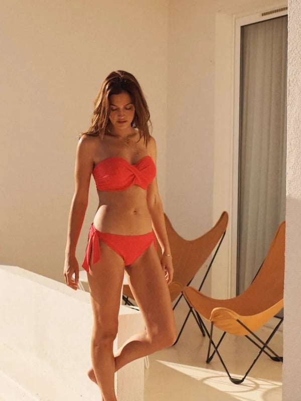 Panache Echo Mock Tie Side Bikini Brief. Mid-rise tie side bikini bottom offering moderate rear coverage. Removable mock tie on the hip. This product is recommended as hand wash only.
