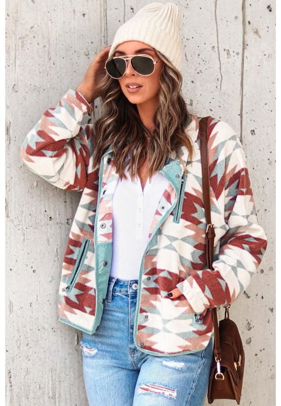 Stylish and trendy Red Western Aztec Buttoned Zipper Pockets Fleece Jacket
  Vibrant red color adds a pop of color to any outfit
  Western-inspired design with Aztec details
  Buttoned closures and zipper pockets for added functionality
  Made from soft and cozy fleece material
  Perfect for cooler weather
  Versatile addition to your wardrobe