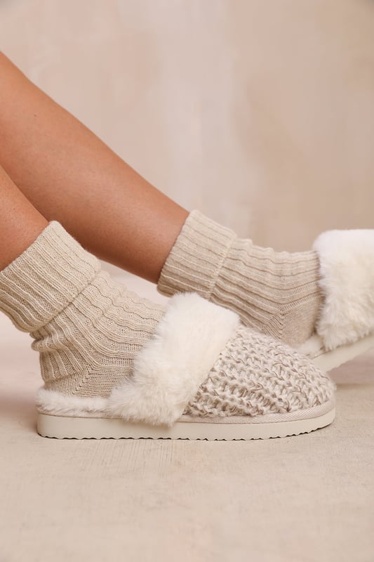 Experience ultimate comfort and cozy warmth with our Lounge Slip On Knitted Slippers With Fur Trim. These luxurious slippers are perfect for lounging at home or keeping your feet snug during colder seasons.Key Features:



Soft Knitted Upper: The knitted upper design adds a touch of style and texture to these slippers, while also providing a comfortable and cozy feel.

Faux Fur Lining: The Faux fur lining envelops your feet in warmth and softness, making these slippers a cozy sanctuary for tired feet. Say goodbye to cold toes and hello to ultimate comfort.

Easy Slip-On Design: These slippers feature a slip-on design, allowing you to effortlessly slide your feet in and out of them. Perfect for those relaxed and casual moments when you need to quickly put on cozy footwear.

Durable Sole: The durable sole provides traction and support, making these slippers suitable for both indoor and outdoor use. Enjoy the versatility of being able to step outside without changing your footwear.

Specifications:Material:


Upper: Synthetic
Lining: Faux fur for warmth and coziness
Sole: Durable sole for indoor and outdoor wear


Closure: Slip-on design for easy and convenient wearing

Pamper your feet with our Lounge Slip On Knitted Slippers With Fur Trim. Indulge in the utmost comfort and enjoy the luxurious feel of these slippers while effortlessly adding warmth and style to your everyday relaxation routine. Say hello to cozy evenings and happy feet with our irresistible slippers.