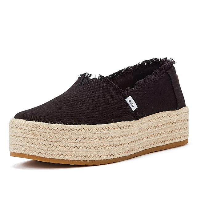 Elevate your style with these trendy espadrille platform slip-ons, featuring stylish textile uppers. The rope wrap platform adds a touch of sophistication to these shoes. Enjoy superior comfort with the padded heel that cushions your feet with every step. The OrthoLite Eco LT Hybrid insoles are made with 26% eco content, including 15% waste foam, 5% recycled materials, and 6% bio-oils, ensuring both comfort and sustainability. The rubber outsole offers excellent grip and durability. With an outsole height of approximately 1.5 inches, these slip-ons provide the perfect amount of elevation. Rest assured, these shoes are completely vegan, catering to your ethical choices. Step out in style and comfort with our exceptional espadrille platform slip-ons.